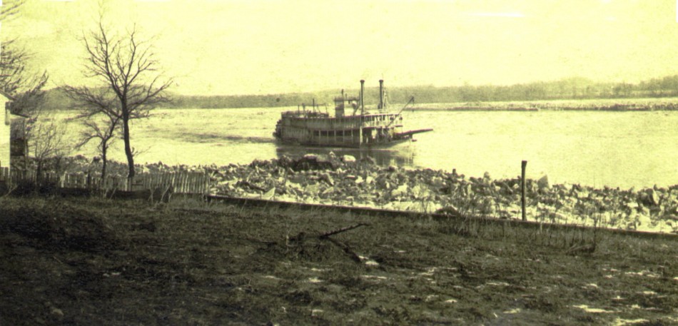 129 Steamboat under way up river & ice